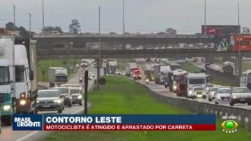 Motociclista é arrastado por carreta em acidente no Contorno Lest